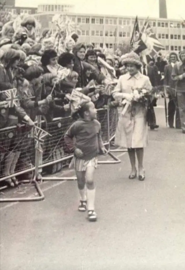 Michelle Martin after presenting the Queen with a bouquet