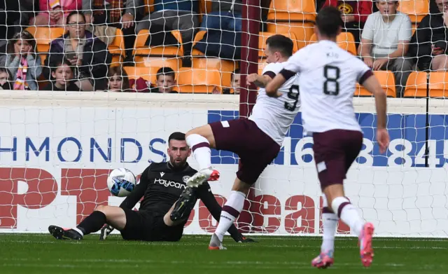 Lawrence Shankland shoots Hearts in front at the second attempt