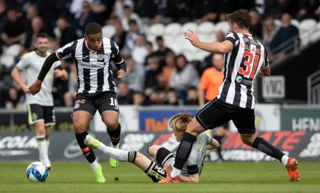 Celtic's Kyogo Furuhashi (centre) is challenged by St Mirren's Ethan Erhahon and Declan Gallagher