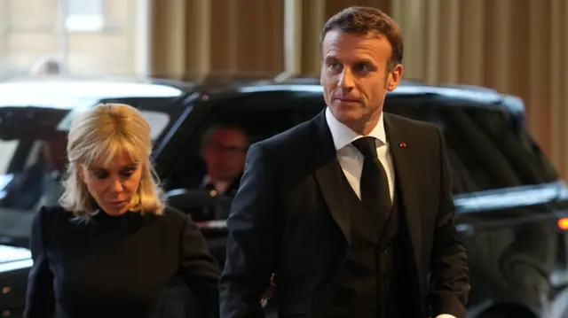 France's President Emmanuel Macron with his wife, first lady Brigitte, arrive at Buckingham Palace