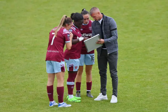 Paul Konchesky gives his team instructions at half time