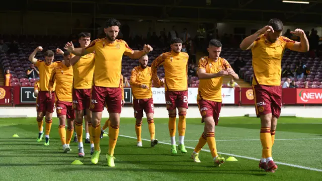 Motherwell players finish off their pre-match routine