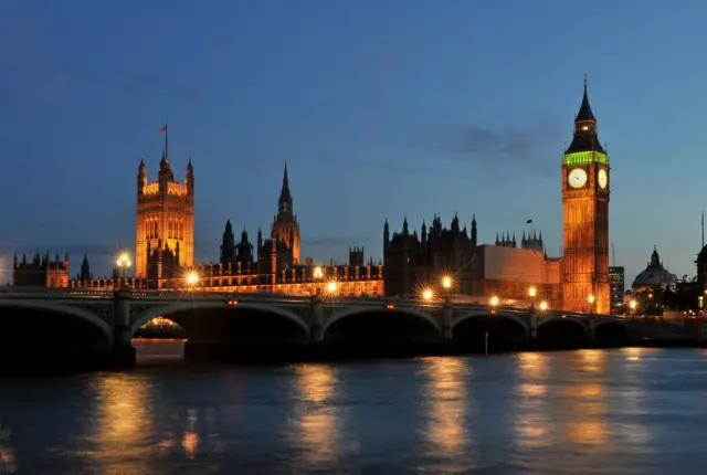 The Houses of Parliament at dusk (around 10pm) seen from across the River Thames downstream from Westminster Bridge.