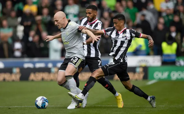 Celtic's Aaron Mooy is hounded by St Mirren pair Jonah Ayunga and Keanu Baccus