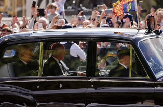 King Charles III arrives at Buckingham Palace