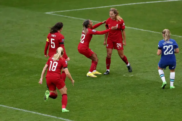 Katie Stengel of Liverpool celebrates with teammates after scoring their side's second goal from the penalty spot