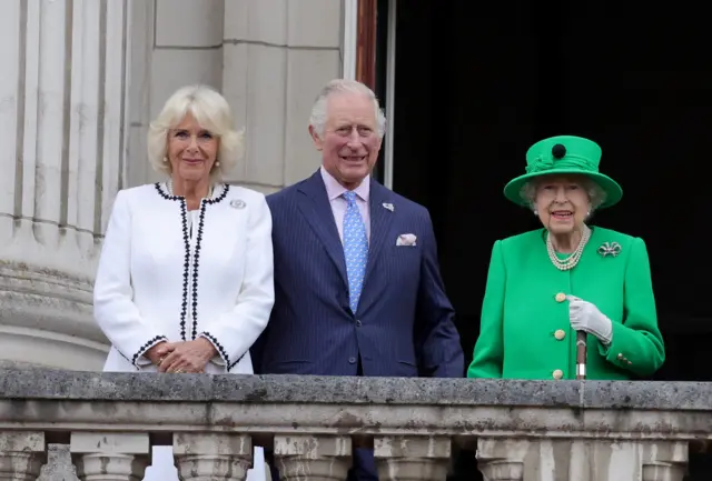 Camilla, the Queen Consort, King Charles and the late Queen stand on the balcony of Buckingham palace during the Platinum Pageant