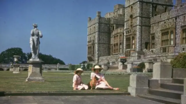 Princesses Elizabeth and Margaret sunbathing outside Windsor Castle in 1941