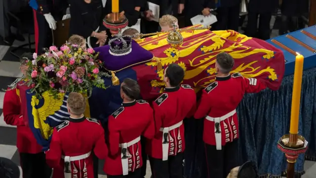 The coffin is placed near the altar