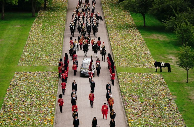 Emma, the monarch's fell pony, stands as the Ceremonial Procession of the coffin of Queen Elizabeth II arrives at Windsor Castle