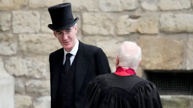 Business Secretary Jacob Rees-Mogg arrives wearing a top hat