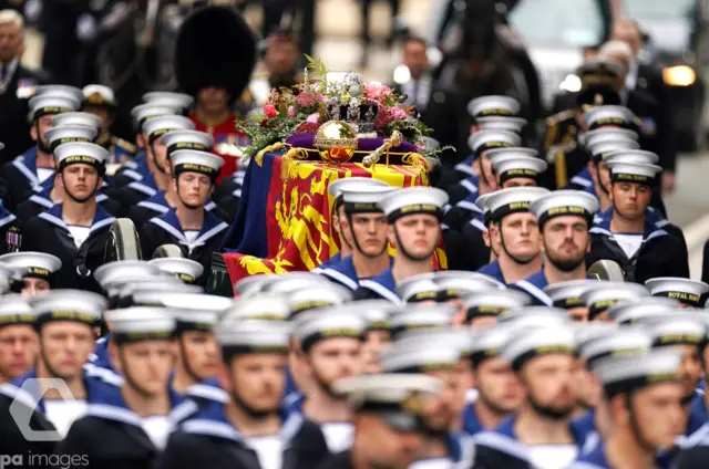 Queen's coffin carried by soldiers