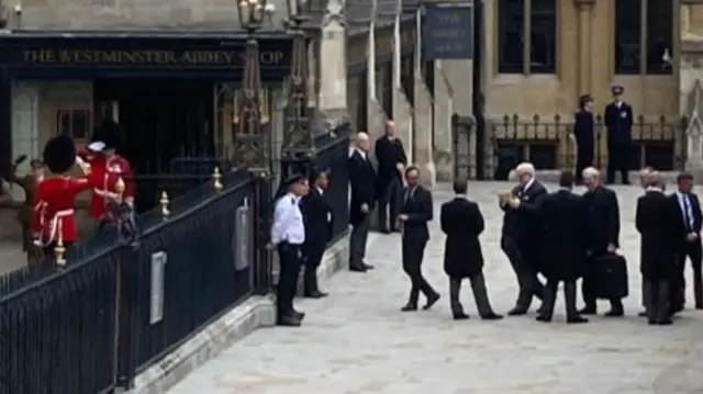 People arriving to funeral