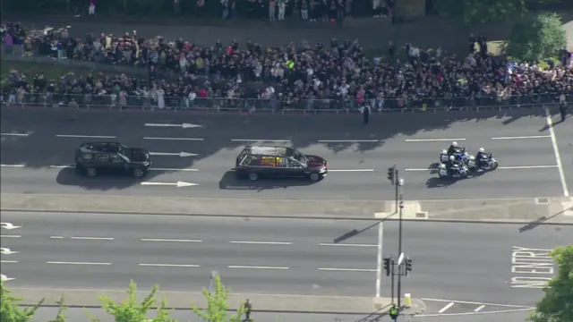 People line the route of the State Hearse as it makes its way from London to Windsor