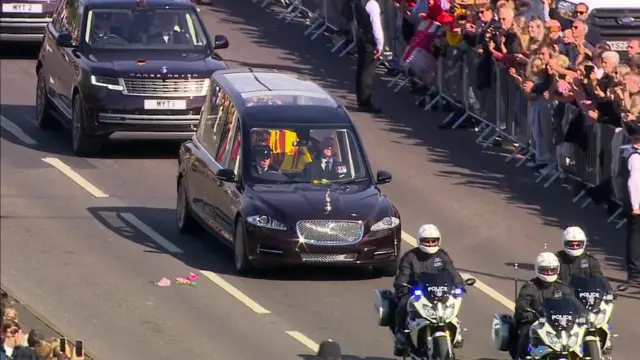 People line the route of the State Hearse as it makes its way from London to Windsor