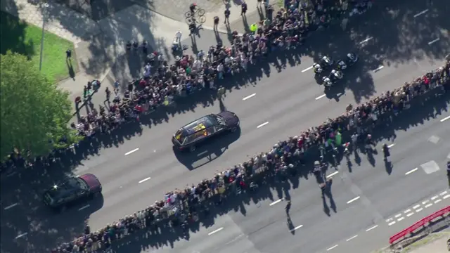 People line the route of the State Hearse as it makes its way from London to Windsor