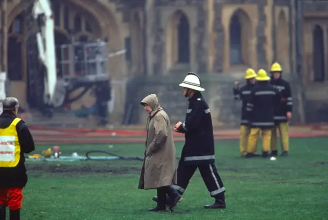 The Queen inspects the damage at Windsor Castle after a fire, 1992