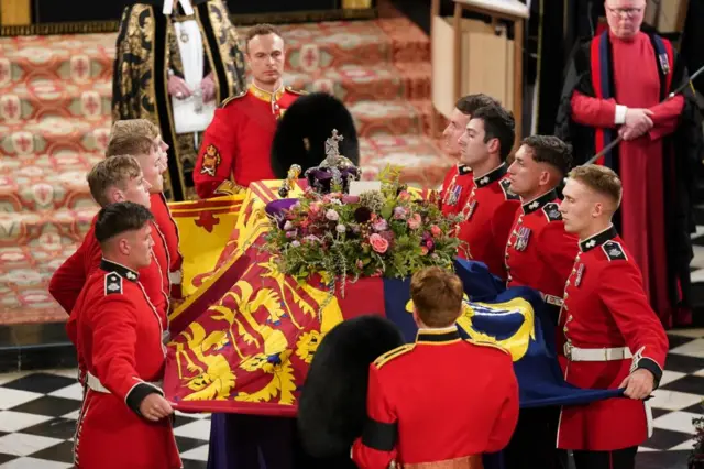 The coffin arrives for the Committal Service