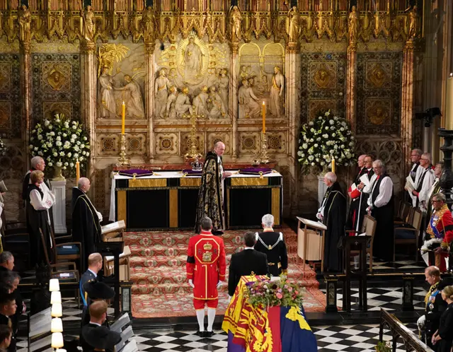 The Imperial State Crown is seen on the high altar after being removed from the coffin of Queen Elizabeth II