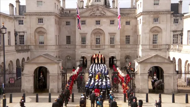 The procession goes under the Horse Guards Arch