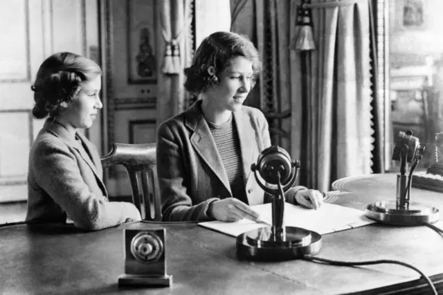 A young Princess Elizabeth speaks into a microphone