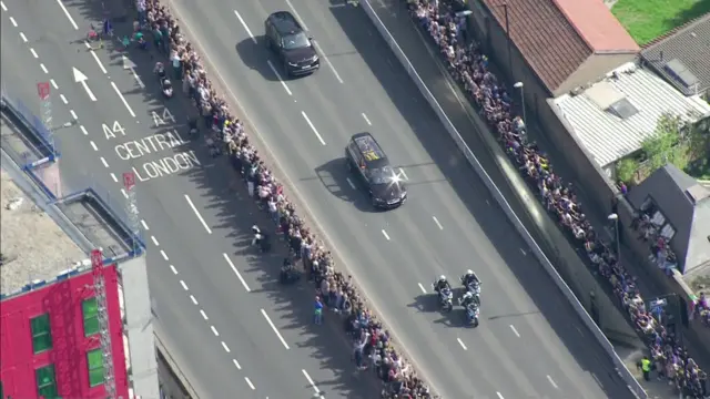 People line the route of the State Hearse as it makes its way from London to Windsor