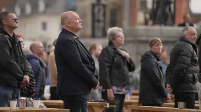 People watching the funeral in Hull