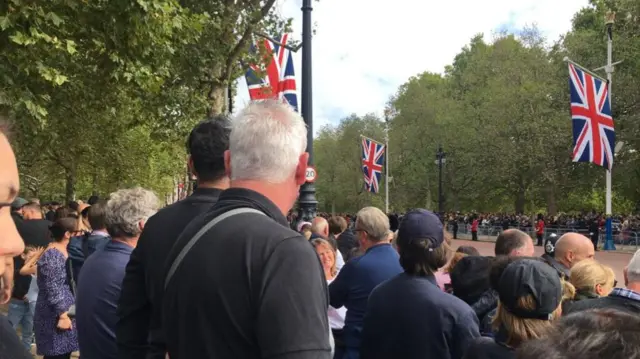 Crowds watch for procession on The Mall