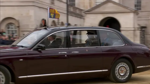 The King and Princes William and Harry make their way to Westminster Abbey