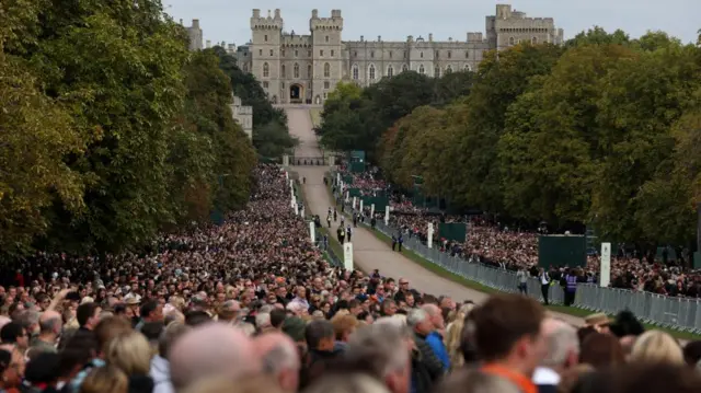 Spectators seen on the Long Walk with Windsor Castle in the background