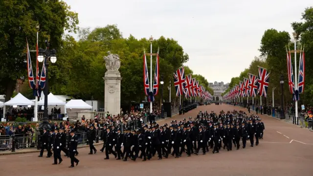 Police officers are seen on The Mall