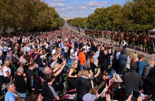 Crowds line the Long Walk to Windsor Castle ahead of Queen Elizabeth's coffin being carried by