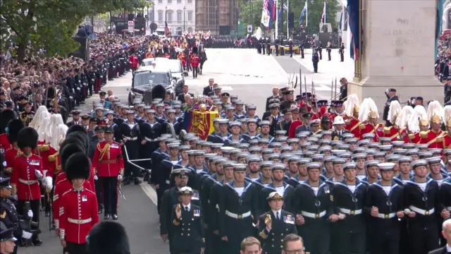 The procession makes its way towards the Mall