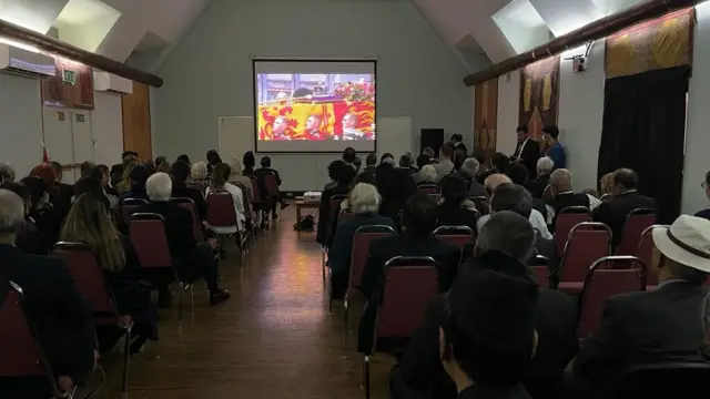 Watching the funeral of the Queen at a special screening at the UK embassy in Kathmandu