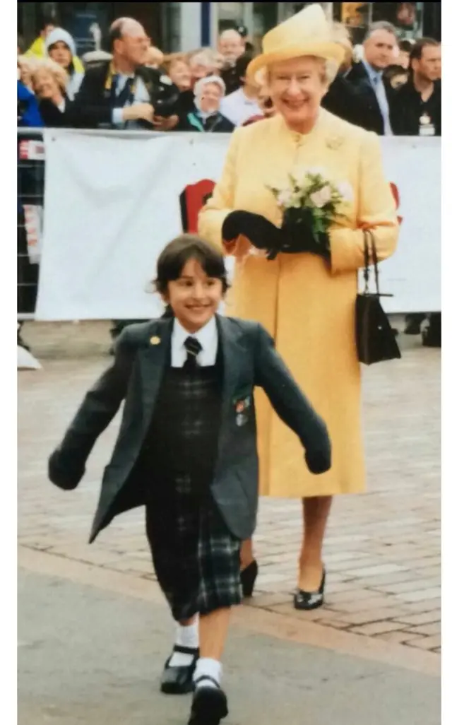 Zara Umar after giving the Queen flowers