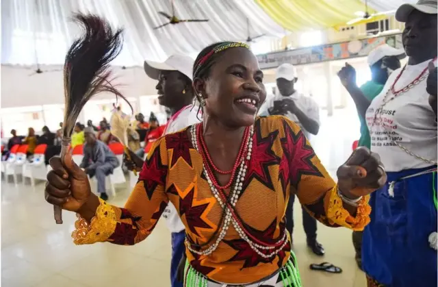 woman dances in Nigeria's Adamawa State, as families of missing people gather to mark the International Day of the Disappeared.