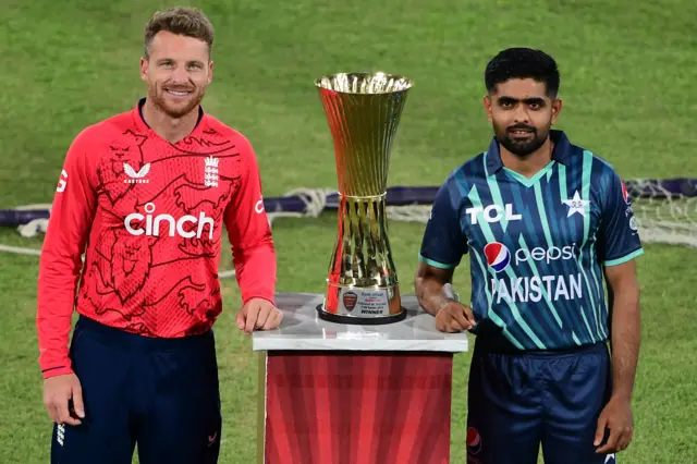 Jos Buttler and Babar Azam pose with the T20 series trophy