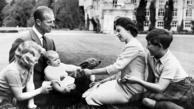 Queen Elizabeth II, Prince Philip, Prince Charles (right), Princess Anne (left) and Prince Andrew pose in the grounds of Balmoral Castle in 1960