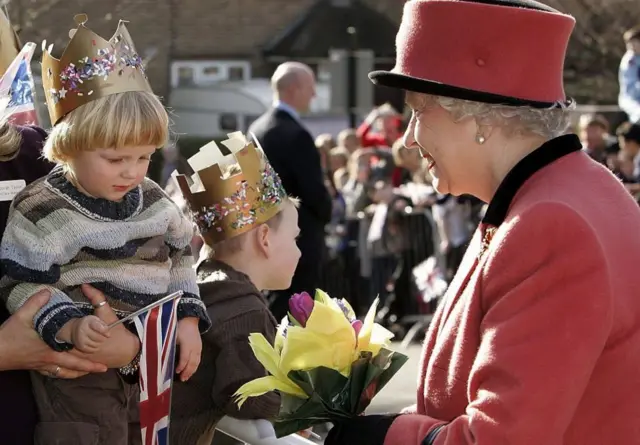 The Queen meeting a young boy