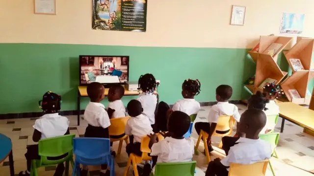 Children at Legon Hills International School watch the Queen's funeral