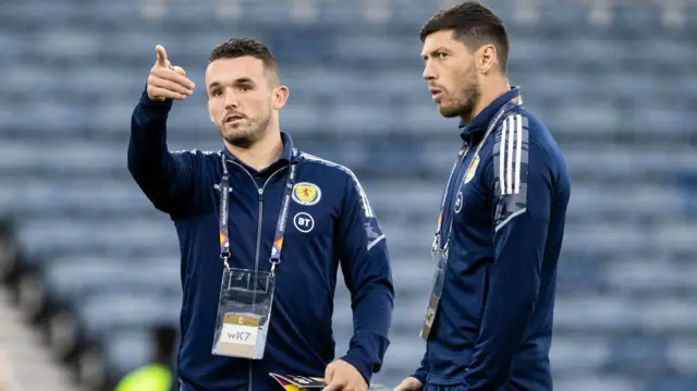 McKenna [right] starts for Scotland this evening