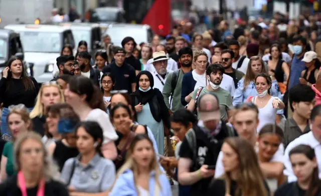 Shoppers on Oxford Street in London, in August 2022