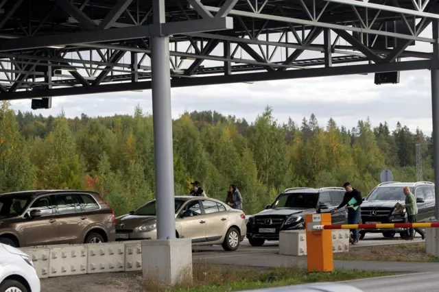 Cars queue to cross the border from Russia to Finland at the Nuijamaa border check point