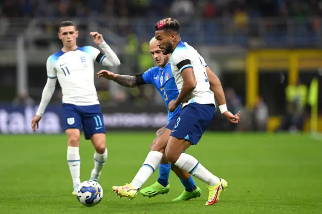 Reece James of England battles for possession with Federico Dimarco