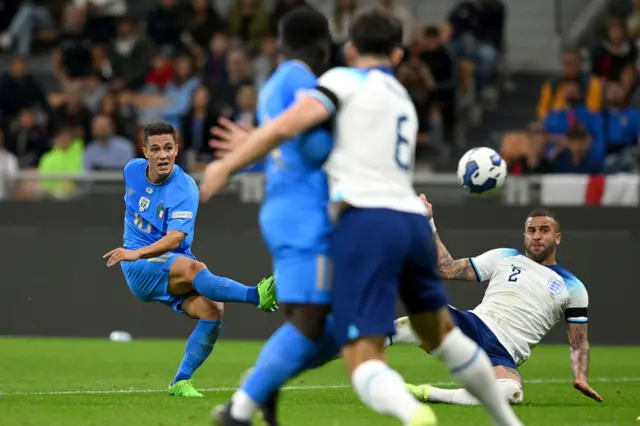 Giacomo Raspadori scores their side's first goal whilst under pressure from Kyle Walker