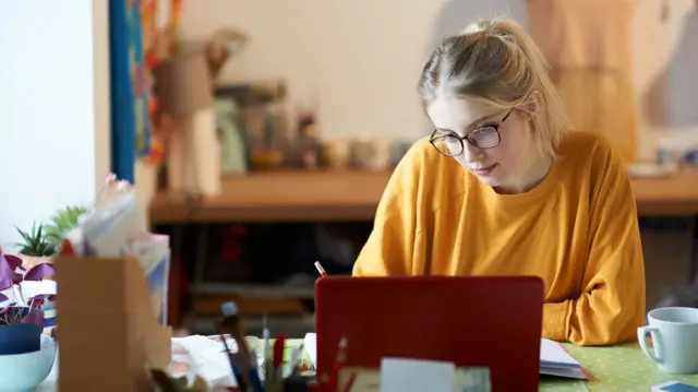 Stock photo of a young woman studying