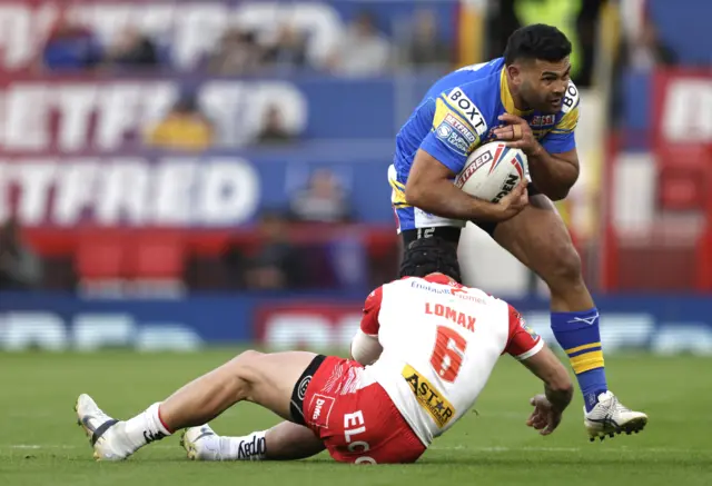 Rhyse Martin is tackled by Jonny Lomax