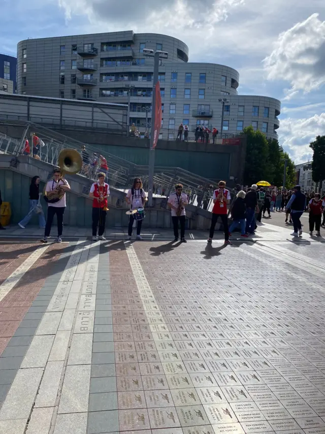 Brass band play outside Emirates stadium