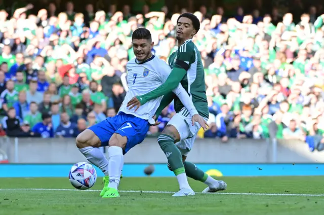 Milot Rashica and Jamal Lewis vie for possession during the first half at Windsor Park