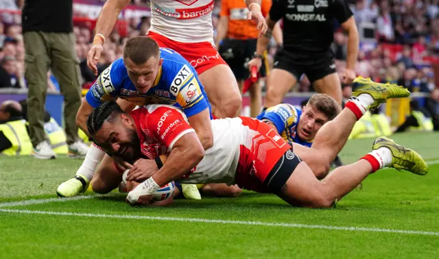 St Helens' Konrad Hurrell is stopped short of scoring a try